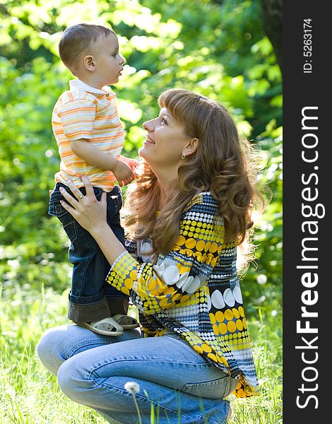 Mother and child outdoors, together and happy