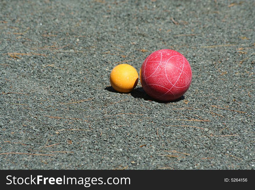 A Red bocce ball near the pallino