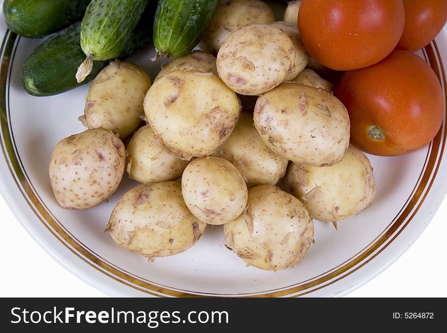 Potato and tomatoes on a white background