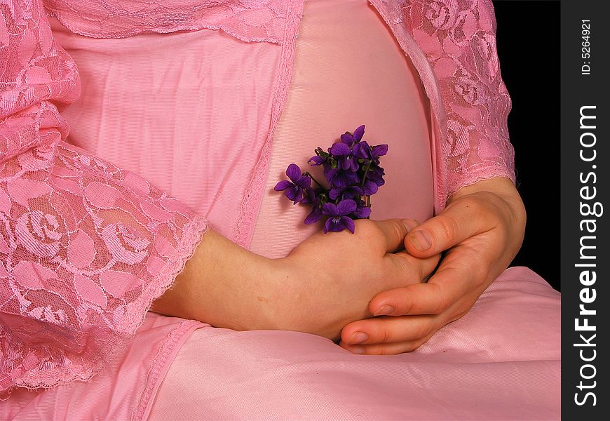 Pregnant woman with violet flower