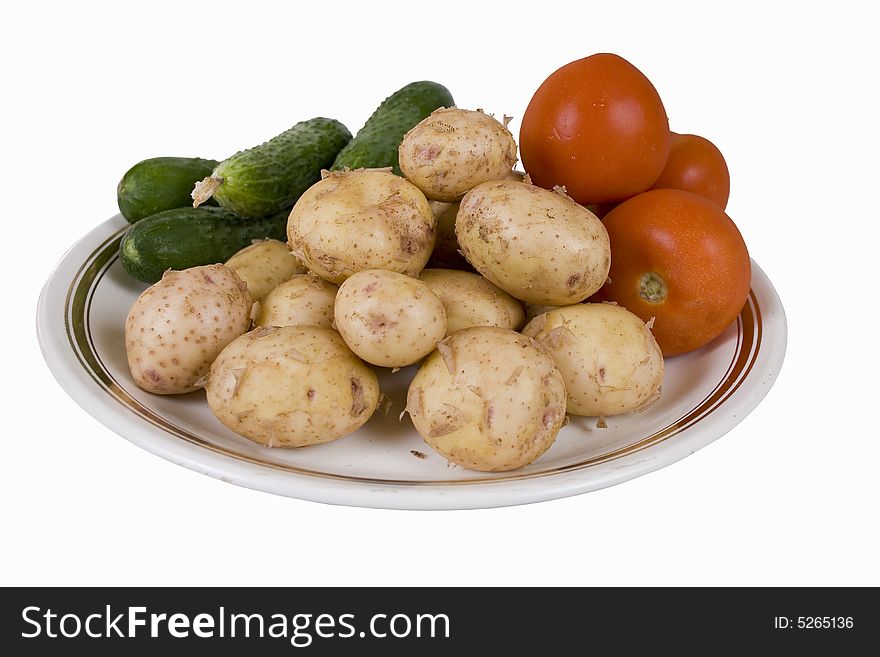 Potato and tomatoes on a white background. Potato and tomatoes on a white background