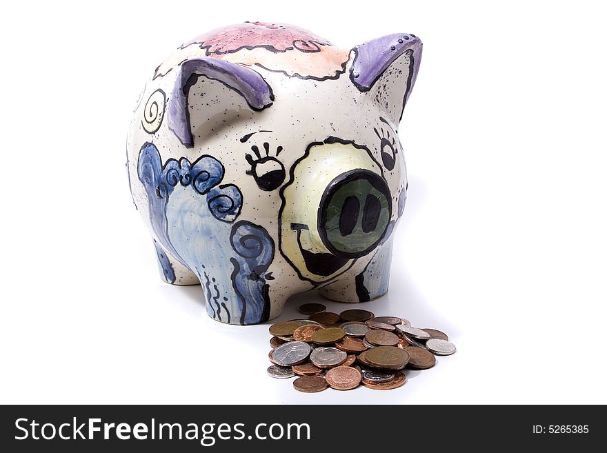 A handmade piggy bank on a white background with money in front of it. Hungre. A handmade piggy bank on a white background with money in front of it. Hungre