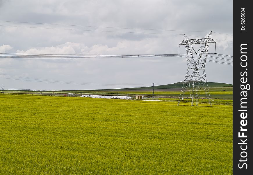Spanish fields and electricity tower, wild nature and electric power.