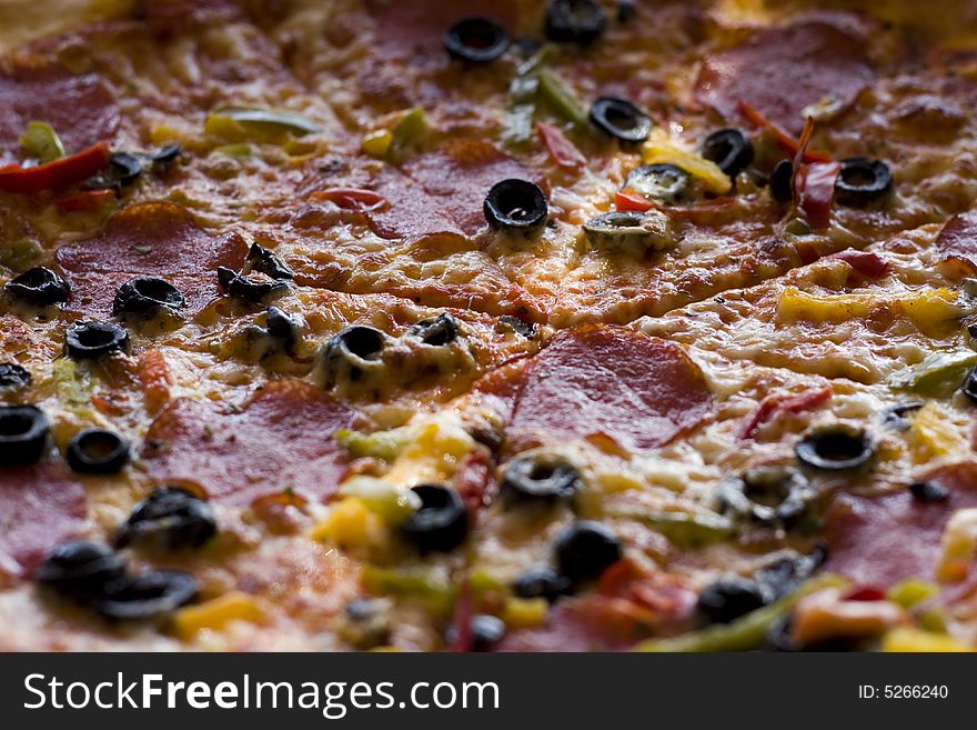 Pizza with salami and olives