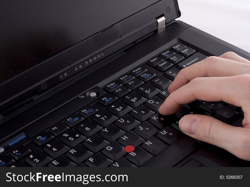 Typing on a black laptop. Typing on a black laptop
