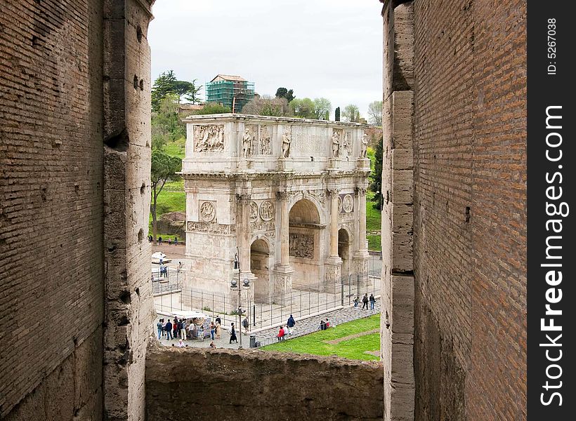 Constantine's Arch as seen through an opening in the Coliseum, Rome, Italy