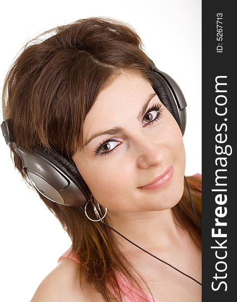 The woman in headphone listening to music. The woman in headphone listening to music