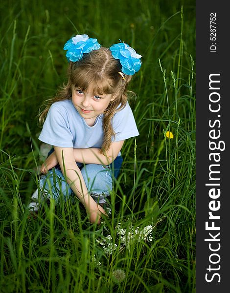 An image of a girl amongst grass. An image of a girl amongst grass