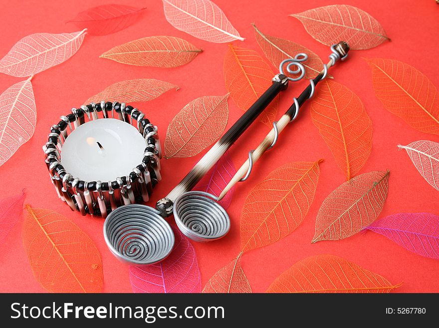 Ethnic Olive Spoons on a leafy red background