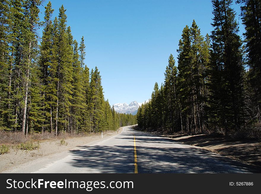 View of snow mountain and winding highway in kananaskis county, alberta, canada. View of snow mountain and winding highway in kananaskis county, alberta, canada