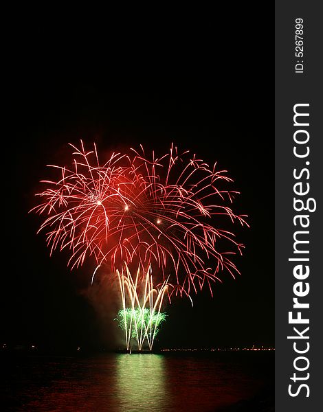 Red flower bouquet fireworks by the bay