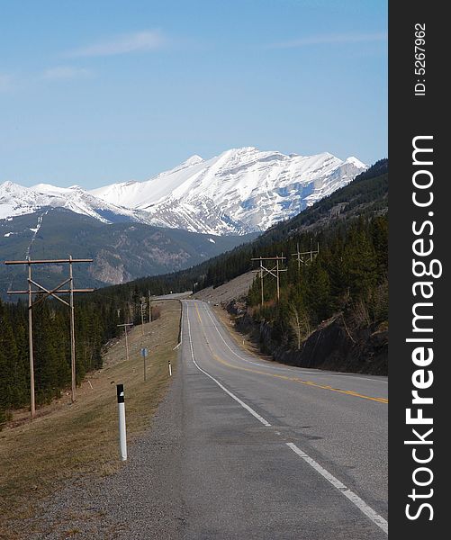 Landscape of spring rocky mountain and highway in kananaskis county, alberta, canada