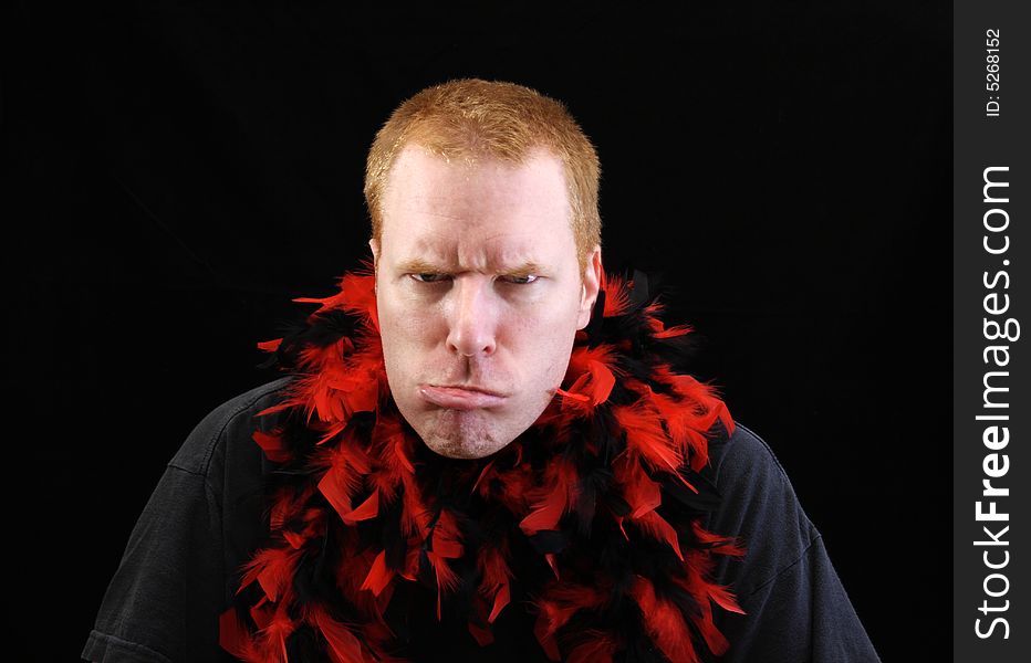 Man angry or frustrated with a lot of feathers