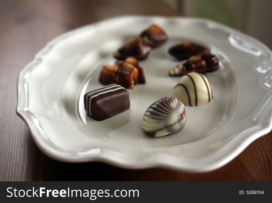 Chocolate pieces in various forms and sizes on a plate