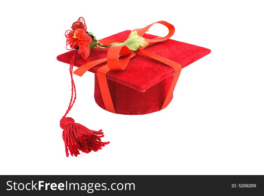 Red graduation cap isolated on white