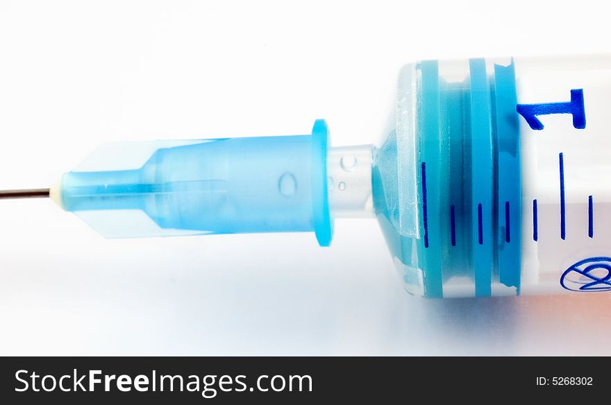 Macro shot of a syringe with soft focus and diffuse effect. Macro shot of a syringe with soft focus and diffuse effect