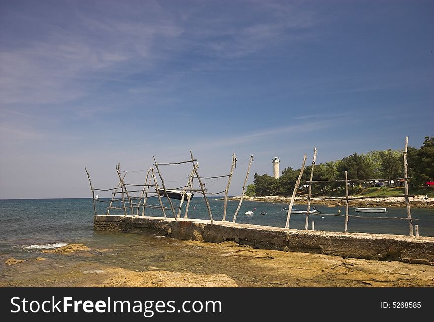 Croatian shore, wooden holders used for lifting boats