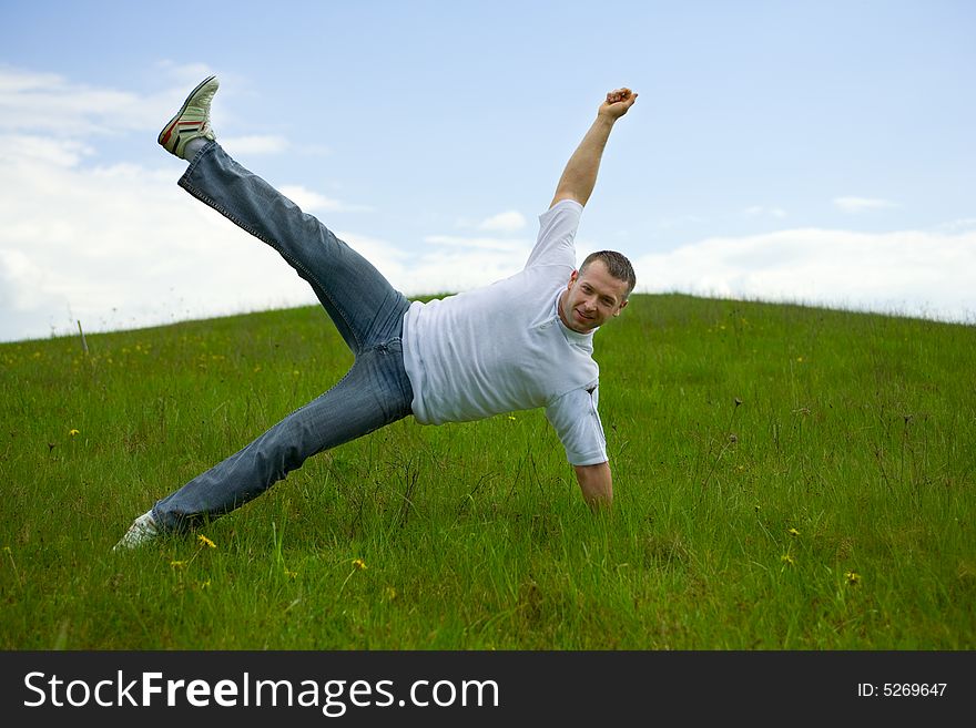 The man jumping on a lawn