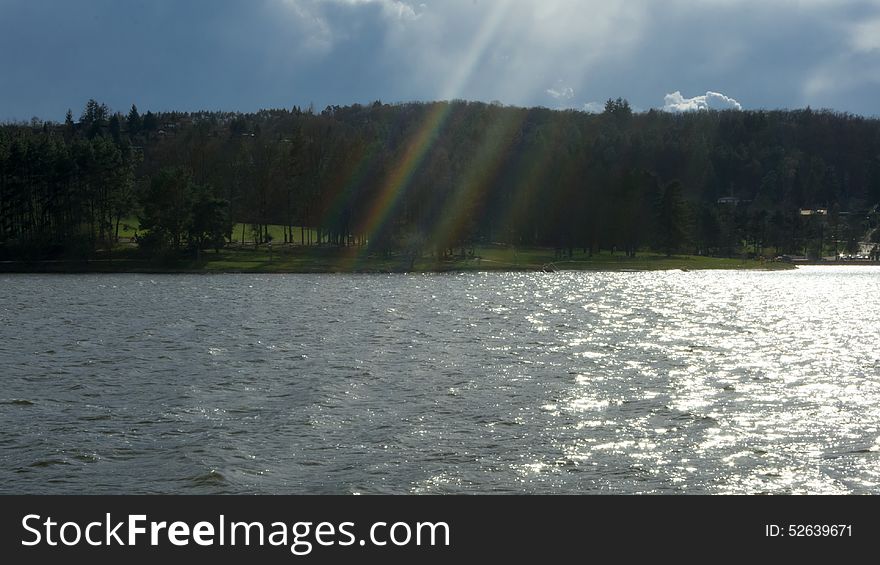 End of the rainbow above the lake