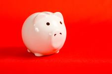 Piggy Bank On Red Royalty Free Stock Photos