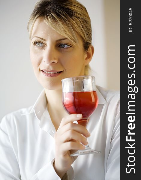 Woman enjoying a glass of wine. Woman enjoying a glass of wine