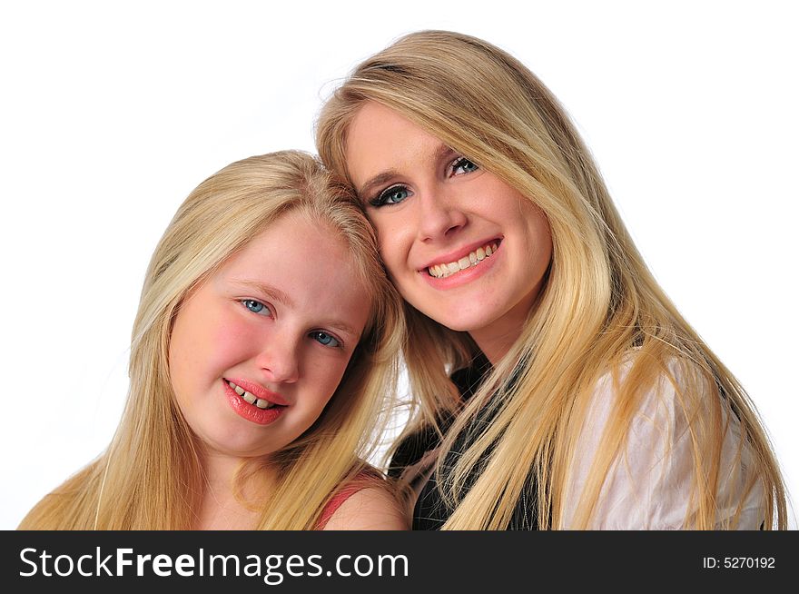 Portrait of two sisters isolated on a white background