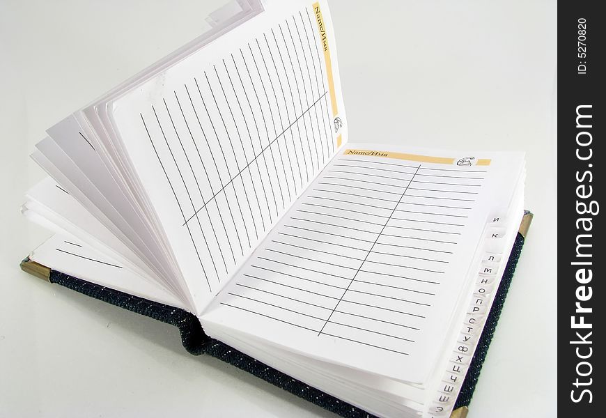 The opened notebook on a white background