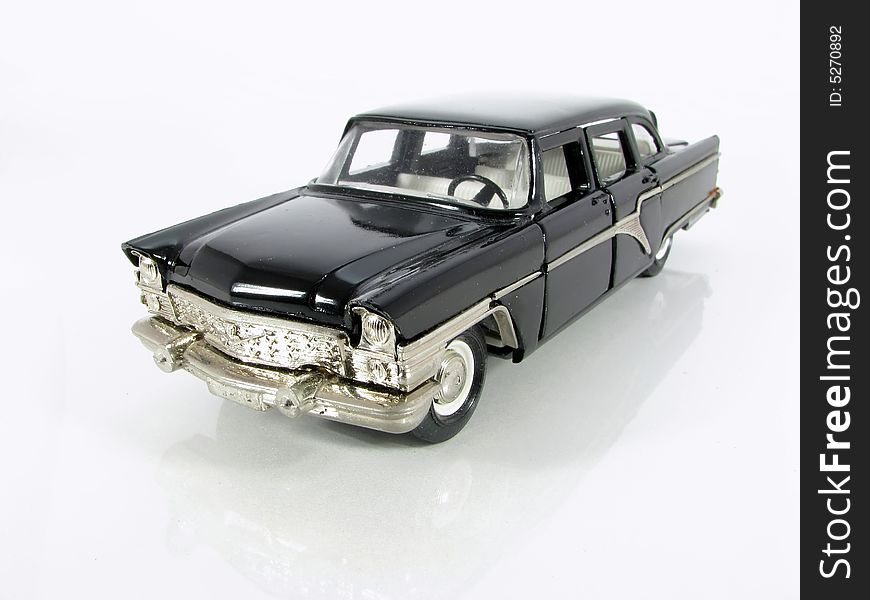 Model of the black car on a white background. Model of the black car on a white background