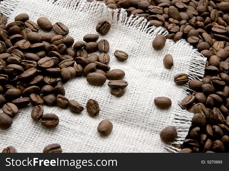 Coffee beans on canvas close-up