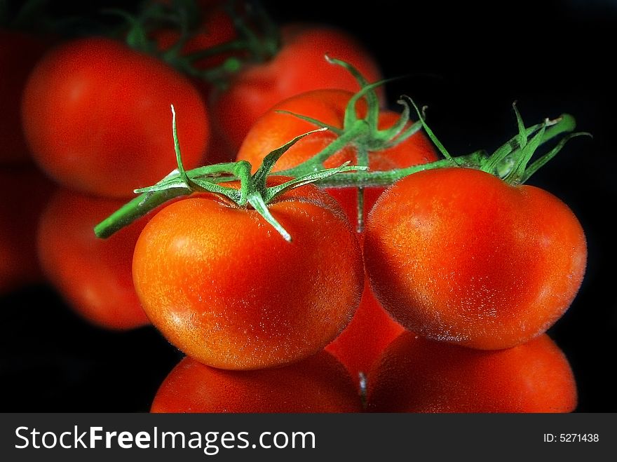 Close up red tomatoes plaÑed in a water with air bubbles. Close up red tomatoes plaÑed in a water with air bubbles