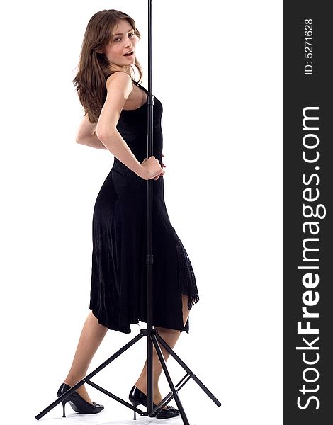 Beautiful dancing girl in black with tripod. Beautiful dancing girl in black with tripod