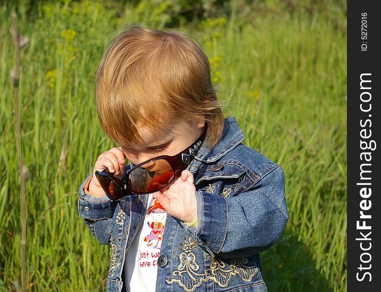 Girl plays with glasses