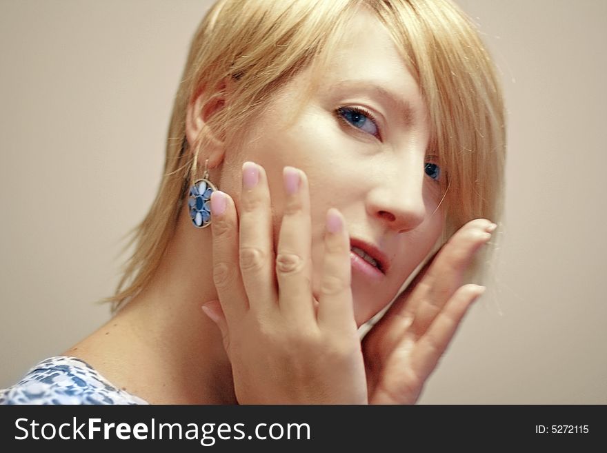 Young woman touch her face. Young woman touch her face