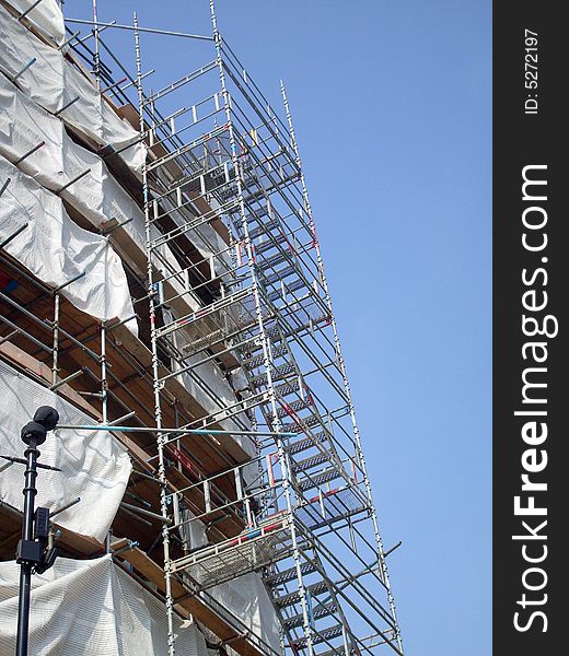 Overview of building site as construction taking place.