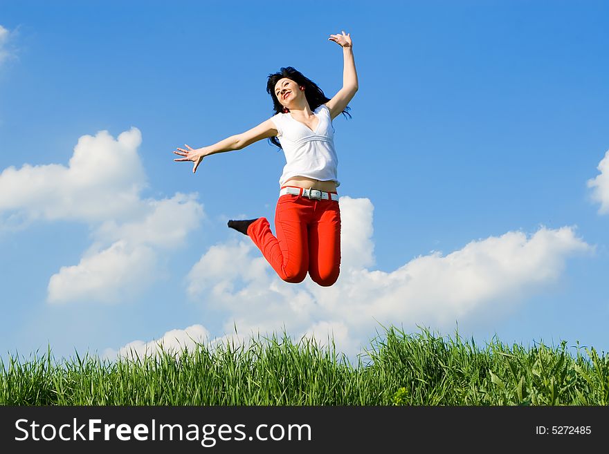 Pretty young woman is jumping