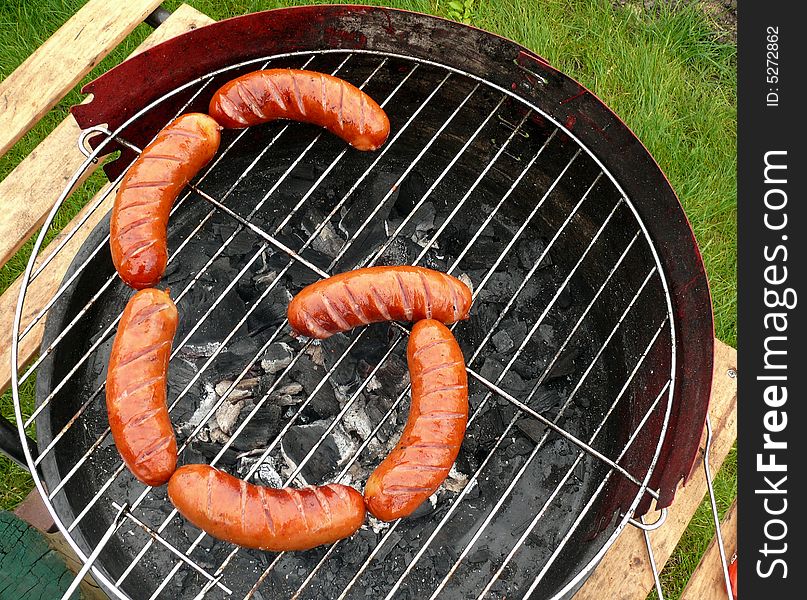 Sausages composition in the form of letter G like grill and grilled. Yummy!. Sausages composition in the form of letter G like grill and grilled. Yummy!
