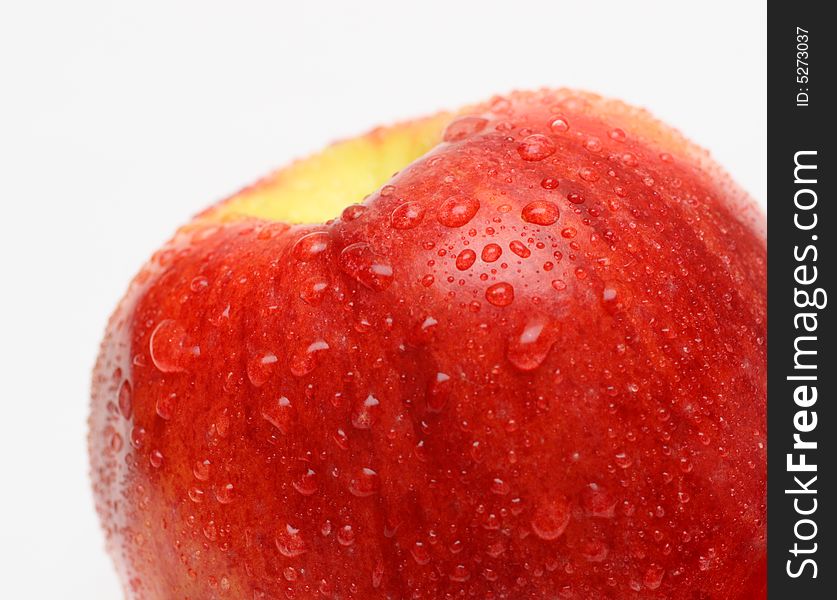 Wet red apple with drops