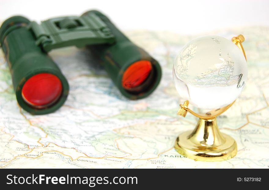 Military binoculars, globe and map. Military binoculars, globe and map