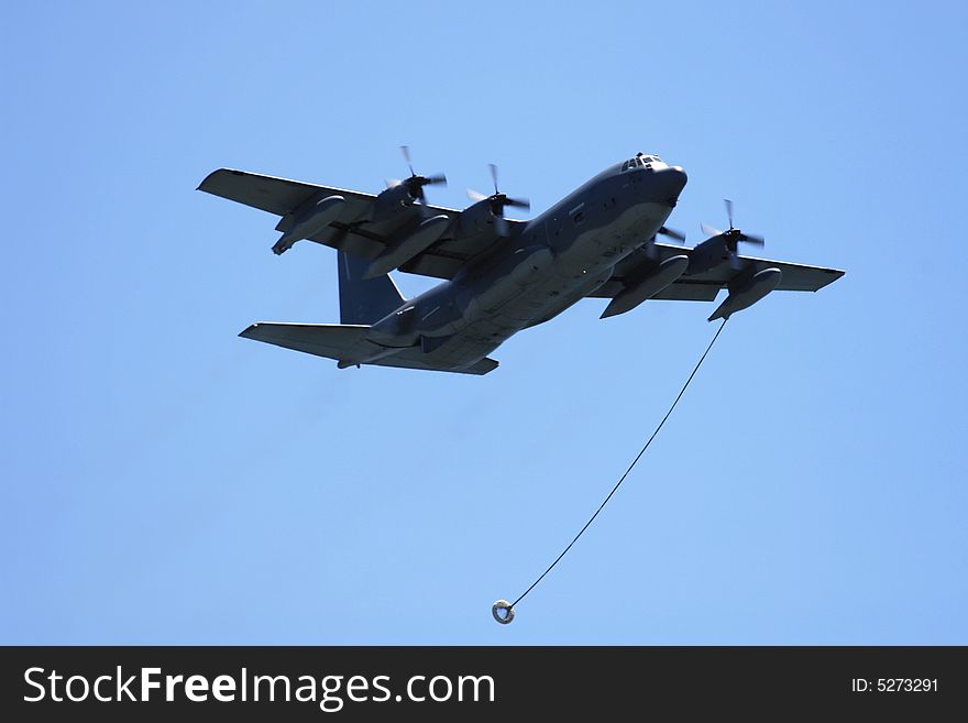 Air National Guard C-130 Hercules fly by, with in air refueling line at Long Island air show