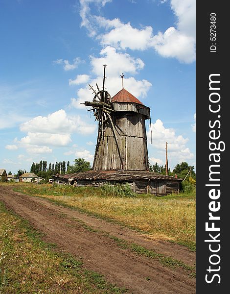 Years landscape with an old rural mill