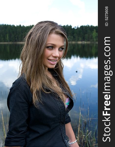 Portrait of young sexual girl on lake background