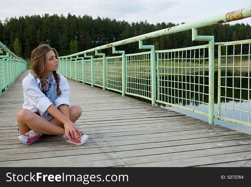 Portrait of young sexual girl on lake background