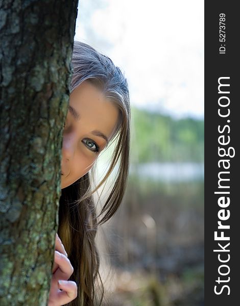 Portrait of young girl on forest background