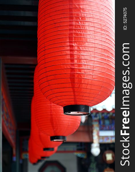 Red lantern hung on the Chinese ancient building. Its implied meaning is joyous, happy and lucky. Red lantern hung on the Chinese ancient building. Its implied meaning is joyous, happy and lucky.