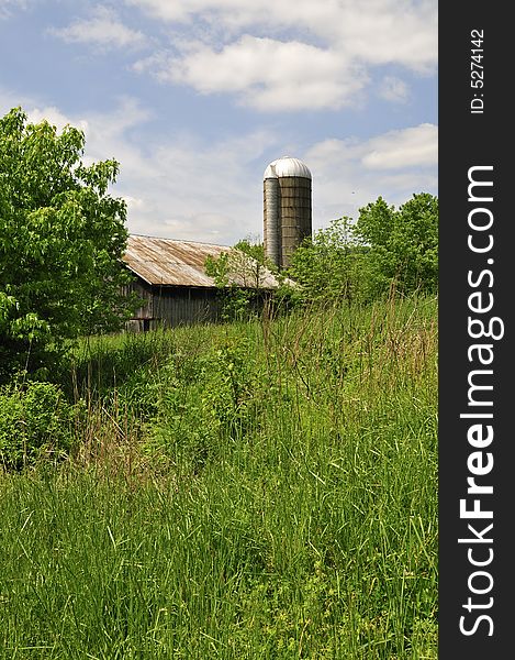 An Old Barn And Silo In The Backwoods of Kentucky. An Old Barn And Silo In The Backwoods of Kentucky