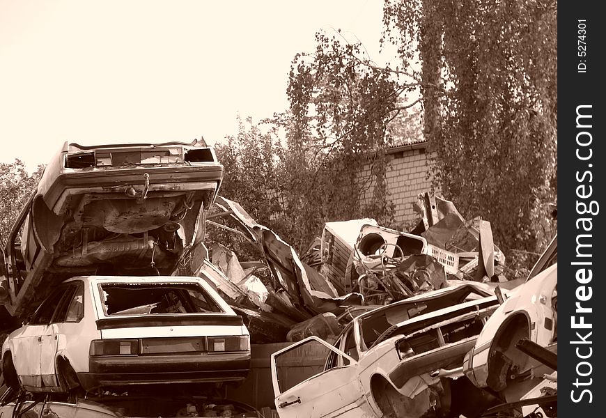 Sepia. wrecked cars. trash metal