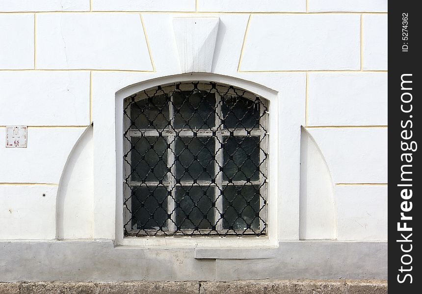 Old window in a wall of a church. Old window in a wall of a church