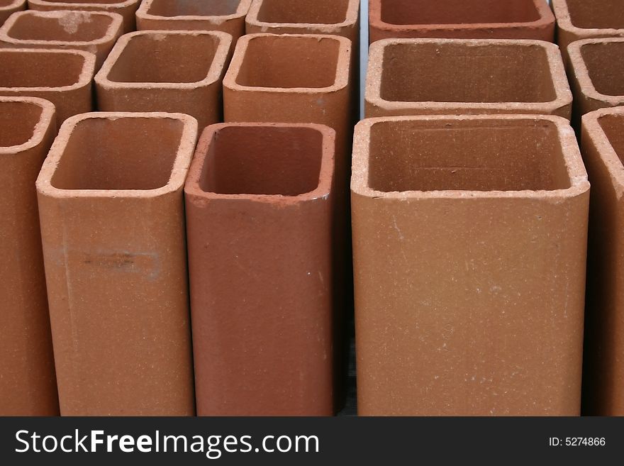 View of terra cotta chimney flues, useful for pattern, design, background for construction, hardware, masonry trades. View of terra cotta chimney flues, useful for pattern, design, background for construction, hardware, masonry trades