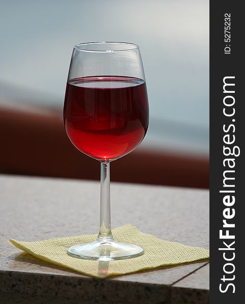 Red wine glass over a dark background. Red wine glass over a dark background