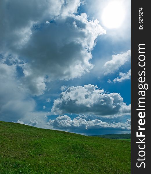 Summer landscape with green grass and blue sky. Summer landscape with green grass and blue sky